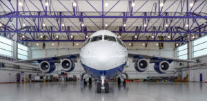 Large four-engine research aircraft inside a hangar