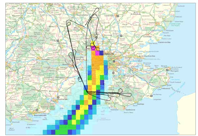 A digital map of the south east of the UK, with black lines showing an aircraft flight track around a multicoloured overlay indicating the intensity and direction of a smoke plume.